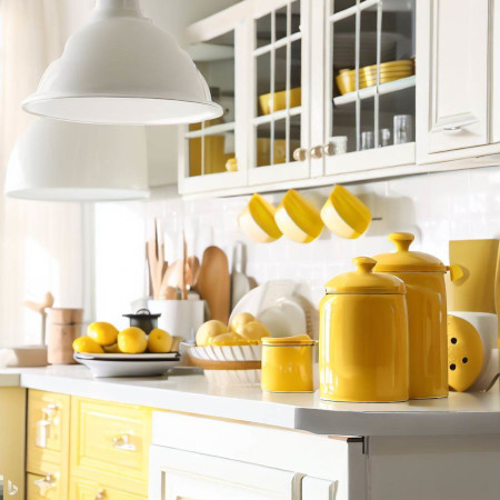 yellow kitchen canister sets add brightness and warmth to a kitchen